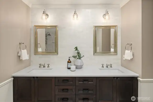 Dual vanities and incredible storage opportunities. Mirrors open for convenient, hidden storage