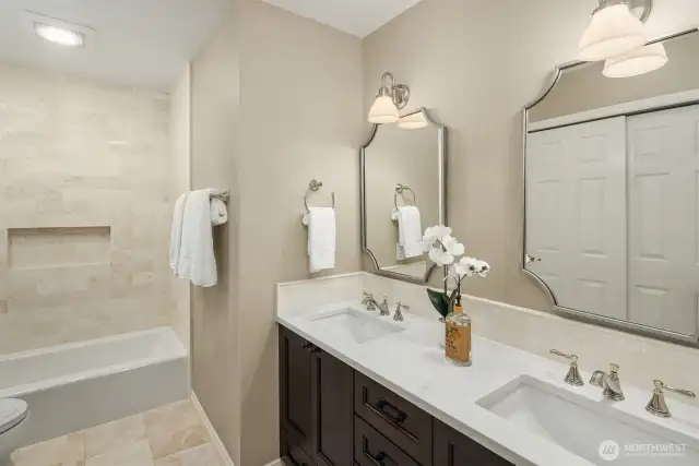 The luxury extends into the family bathroom with marble floor and wall tiles.