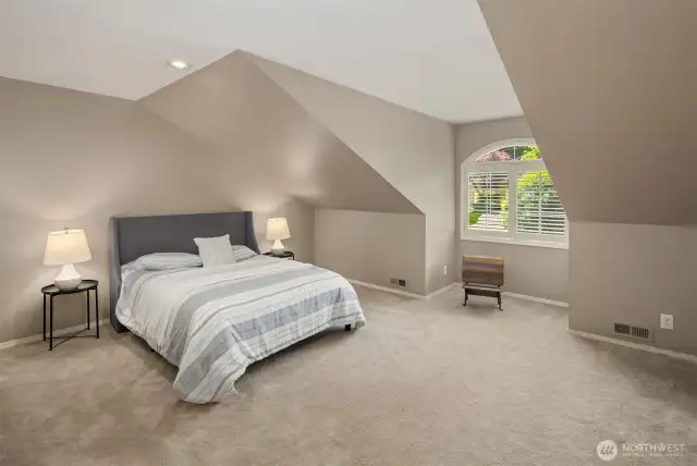 A versatile loft space - staged as a fourth bedroom - in a separate wing of home. Lovely light, closet for storage. Use as a guest room, media room, play room. You decide!