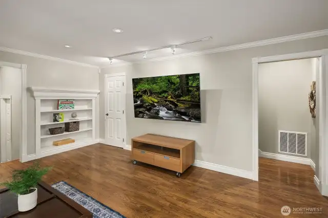 Lots of built in cabinetry for storage and behind the closed door is a walk in closet with California Closet style shelving.
