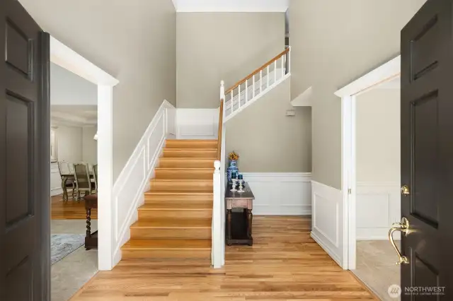 Soaring ceilings and refinished hardwood floors provide an immediate welcome