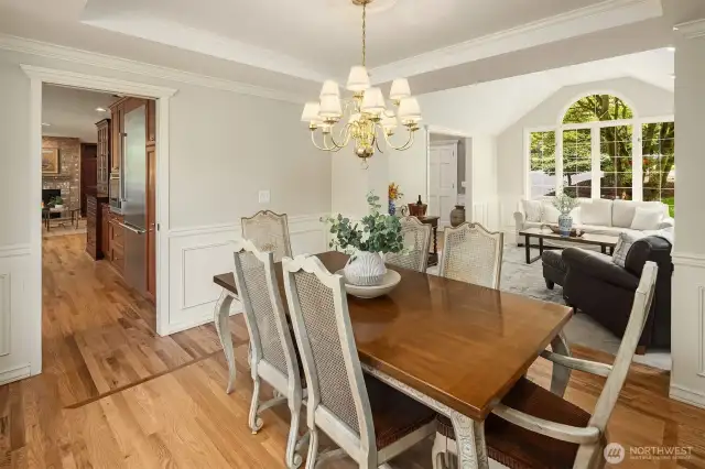 Seamlessly connected to the kitchen and a wonderful perspective overlooking mature landscaping and manicured lawn