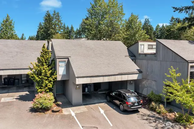 Front of the townhome. One car carport with lockable storage.