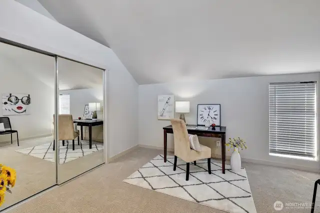 second bedroom with mirrored doors, high ceilings. Washer/Dryer hook up located here.