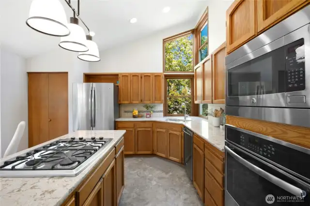 A closer look at the stunning kitchen, featuring ample counter space for those who love to cook!