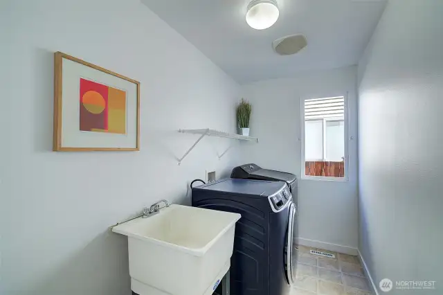 Laundry room on main floor near garage entry.