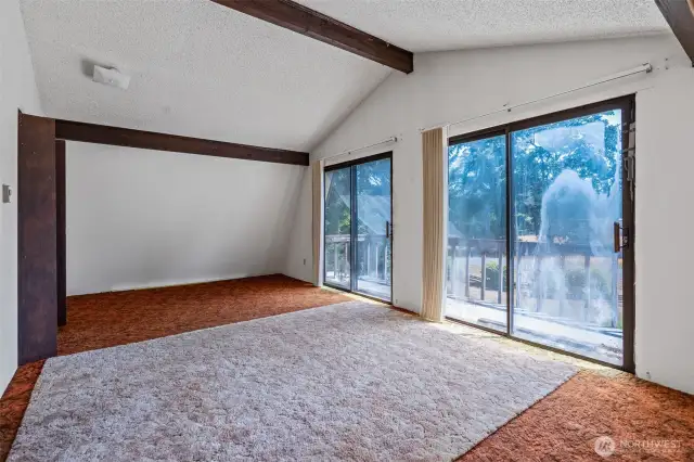 Largest bedroom upstairs with double sliders to upper deck out front