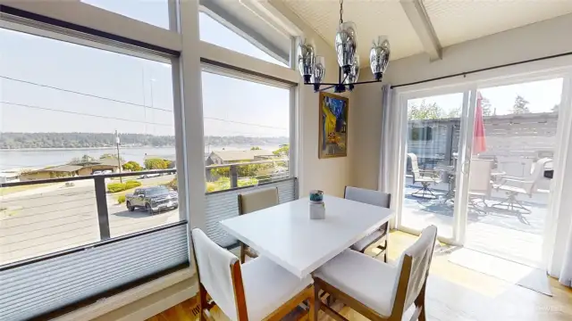 Dining off the kitchen and living area with views!