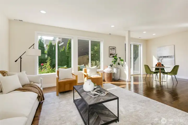 Island kitchen living room and breakfast nook with slider to entertainment deck