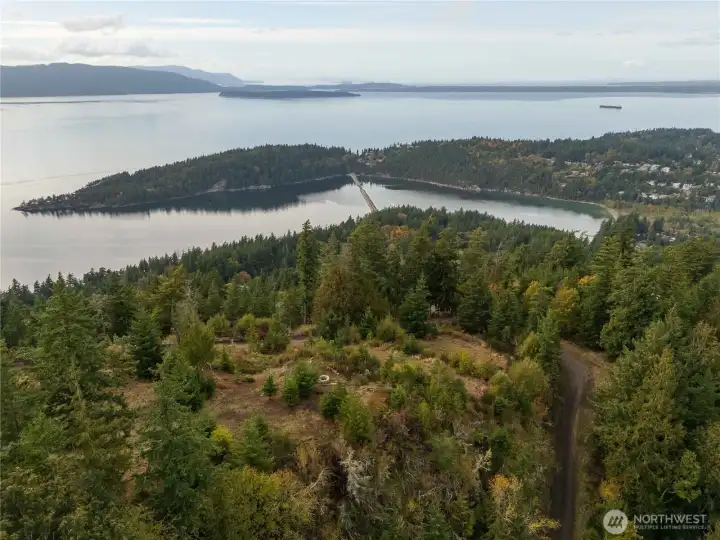 A drone view from the eastern border of the property showing the build site (fire pit) looking west.