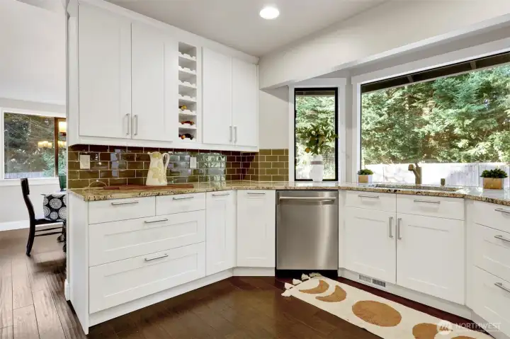 Soft close drawers and cabinets, a built-in wine rack and a peek into the adjoining dining room and living room.