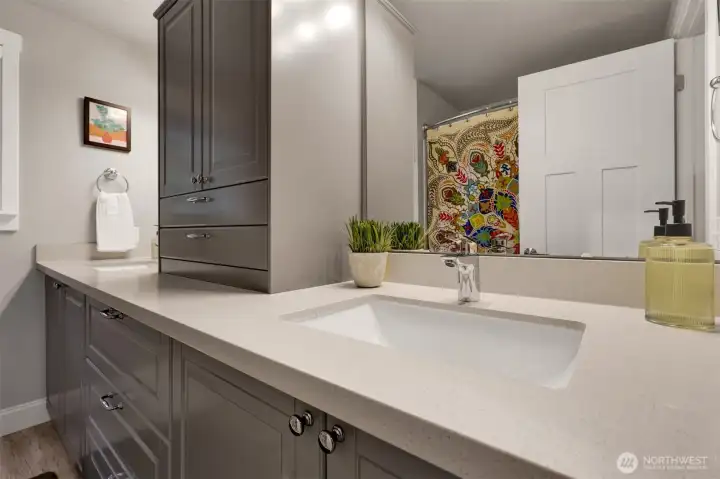 Full bath upstairs has a ton of storage and a tub/shower combo.