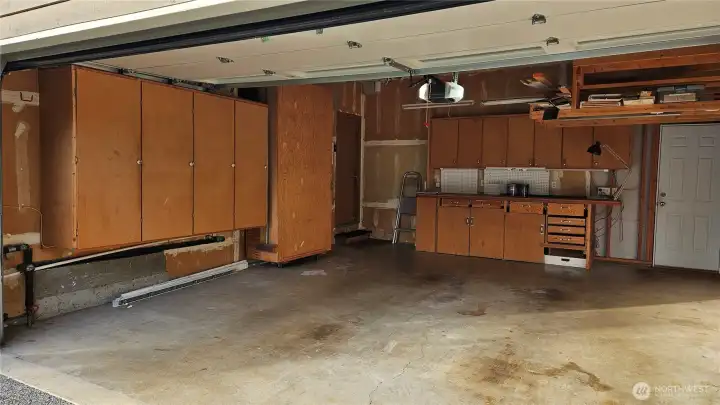 Garage has a workbench in the back and a bunch of storage for all your goodies. Door also leads to the backyard.