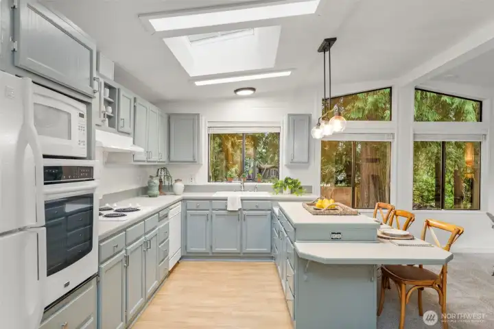 Oversize windows and skylights bathe the home in delicious year round sunlight.