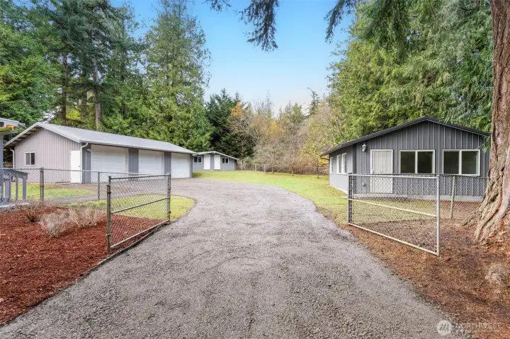 A fully fenced backyard offers a safe space for furry friends or miniature humans.