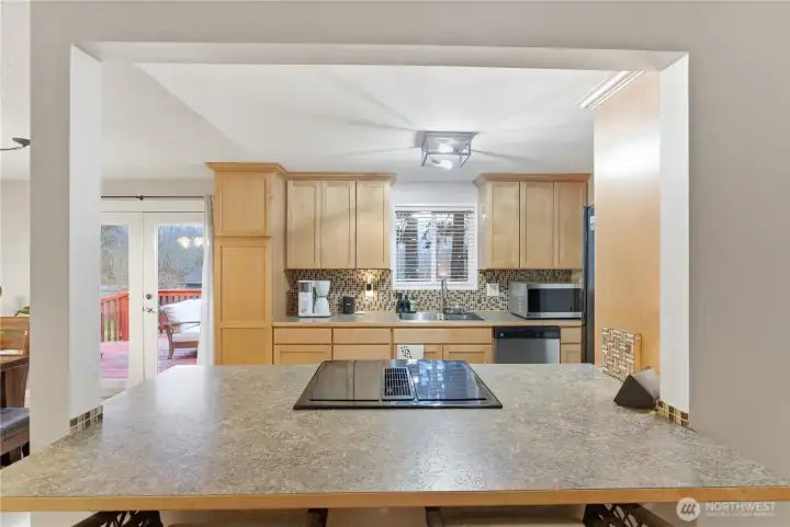 view from the eat at bar into the kitchen