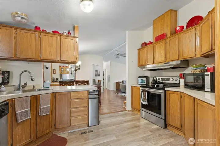 Large kitchen with abundant cabinets and counter space all stainless appliances are included.