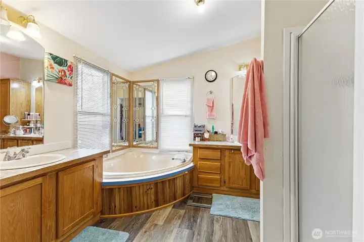 Primary with 2 vanity and sinks walk in shower and soaking tub plus walk in closet.