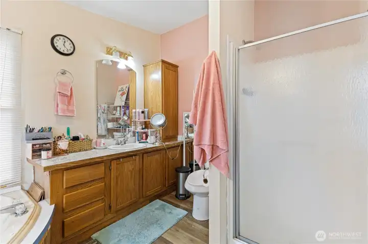 Primary with walk in shower and large soaking tub