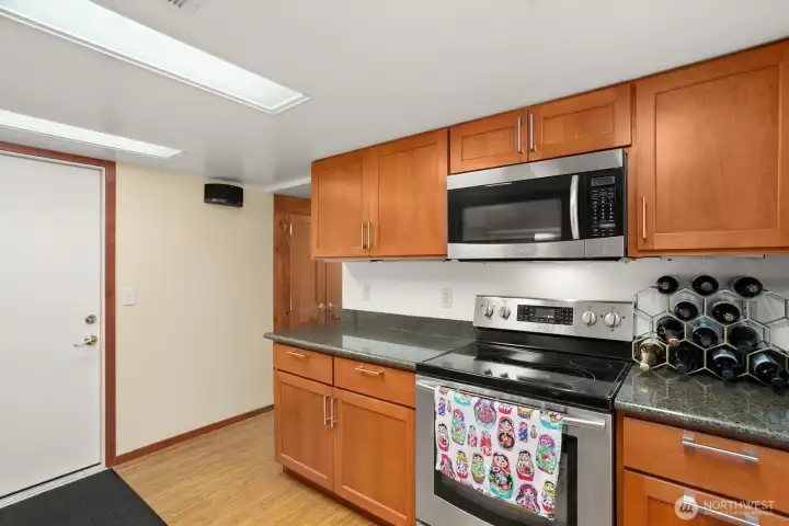 Lower level ADU w/ bedroom, gas fireplace, living room, 3/4 bath, kitchen, laundry and access to 1 car garage.