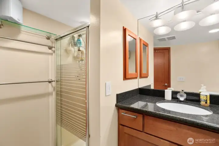 Lower level ADU w/ bedroom, gas fireplace, living room, 3/4 bath, kitchen, laundry and access to 1 car garage.