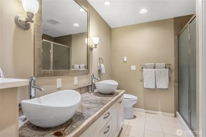 This is a 3/4 bath connected to the main floor office. Through a doorway just off to the right is the laundry room. The office is big enough to make this a main-floor junior suite.