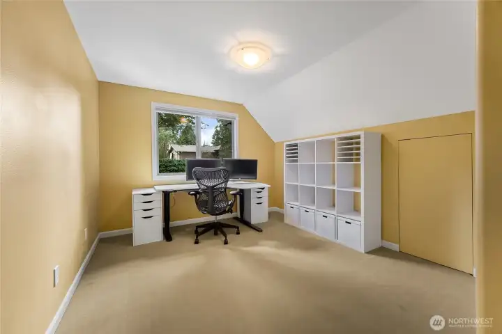 Bedroom 3 is adjacent to Bedroom 2, over looking the back yard.