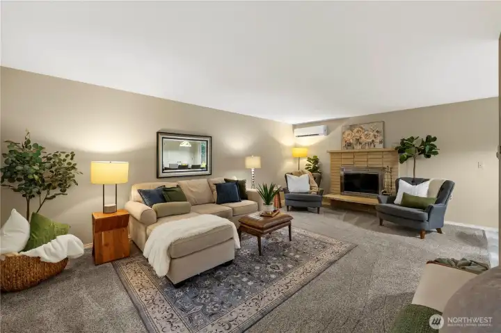 Gracious sized living room with large wood burning stove.