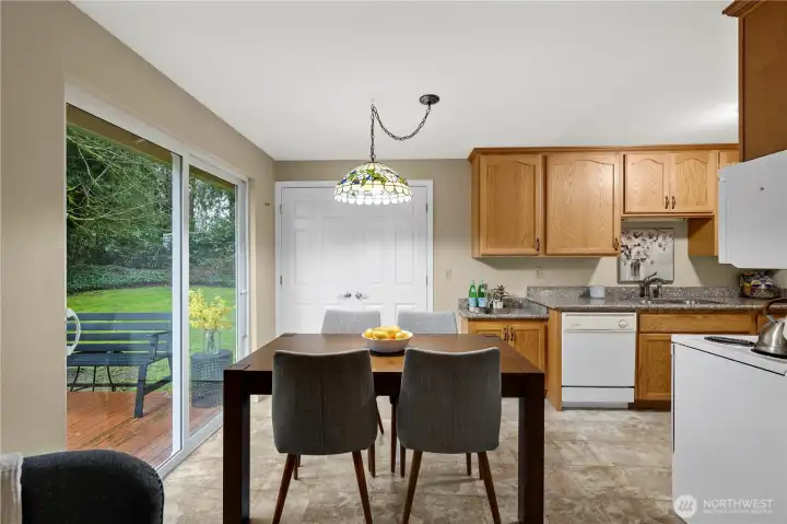 Dining area open to the kitchen and adjacent to the back deck for indoor/outdoor living.
