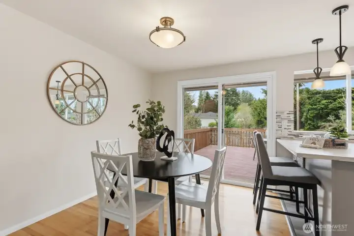 Informal dining area with slider to the entertainment size deck overlooking the backyard.