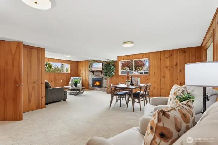 Lower level family room is as big as it looks! Real knotty pine wood paneling creates a cabin-like atmosphere.