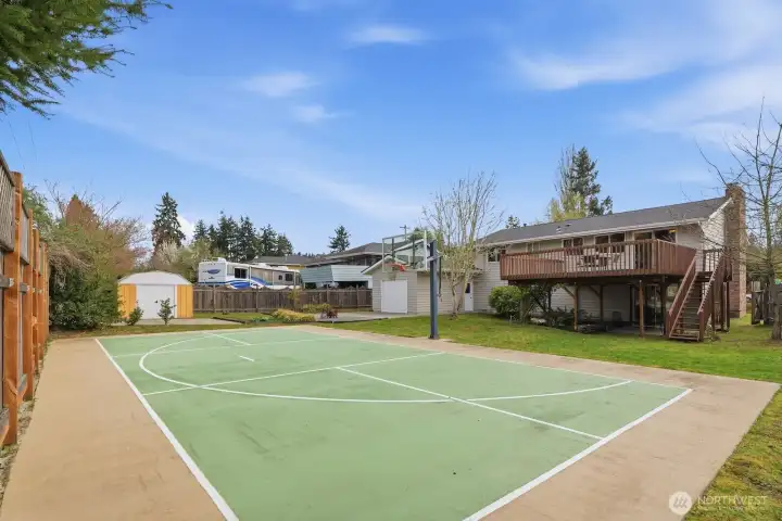 Awesome sport court with pickleball court and basketball three point line already painted on.