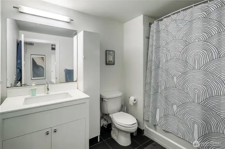 Full bathroom with granite countertops