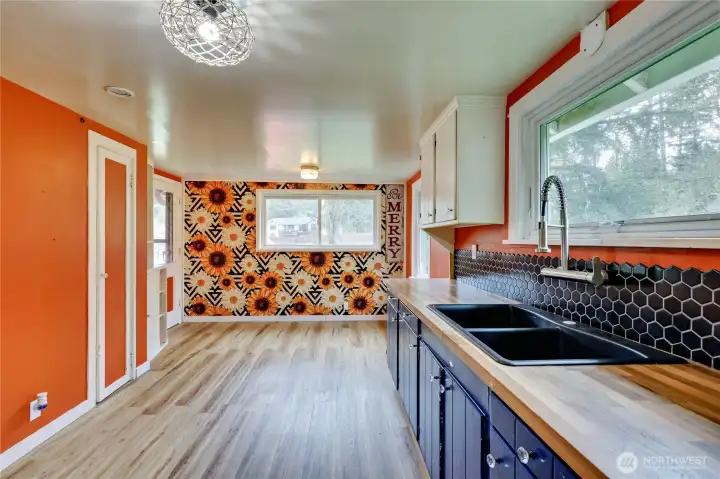 New flooring has replaced this. Dining area in kitchen.