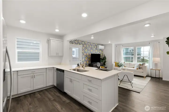 Spacious kitchen island with quartz countertops. Photos are for representational purposes only, colors, elevation and features may vary.
