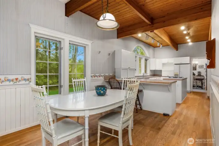A cozy breakfast nook sits off the kitchen. out of view is the large pantry for storage.