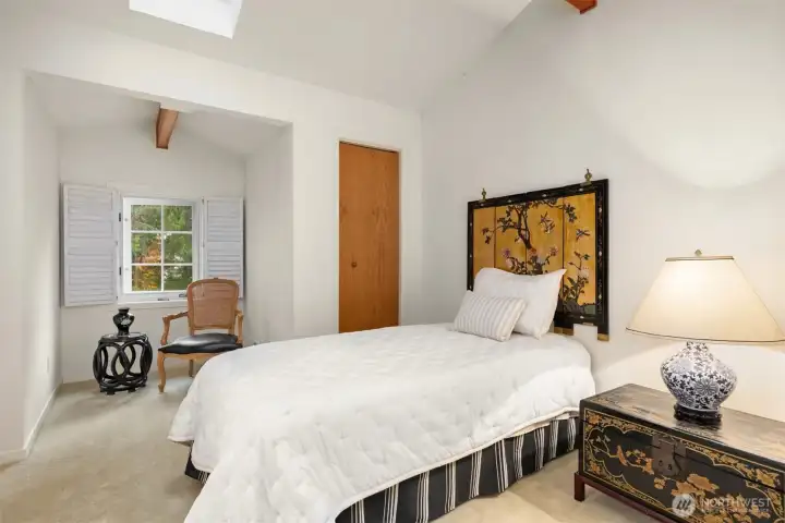 Bedroom #2 is on the second level and shares a Jack-n-Jill bath with the 3rd bedroom. Vaulted ceilings give this room a light and airy feeling. Two closets- one with cedar wood lining.