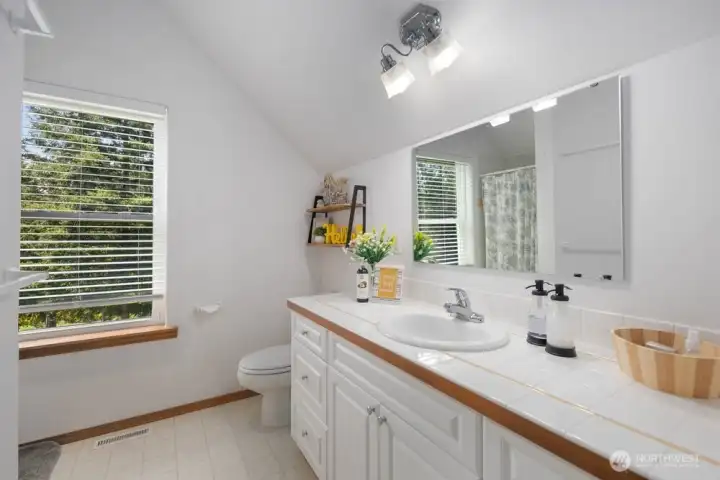 Ensuite bath adds comfort and privacy to this upper-level retreat