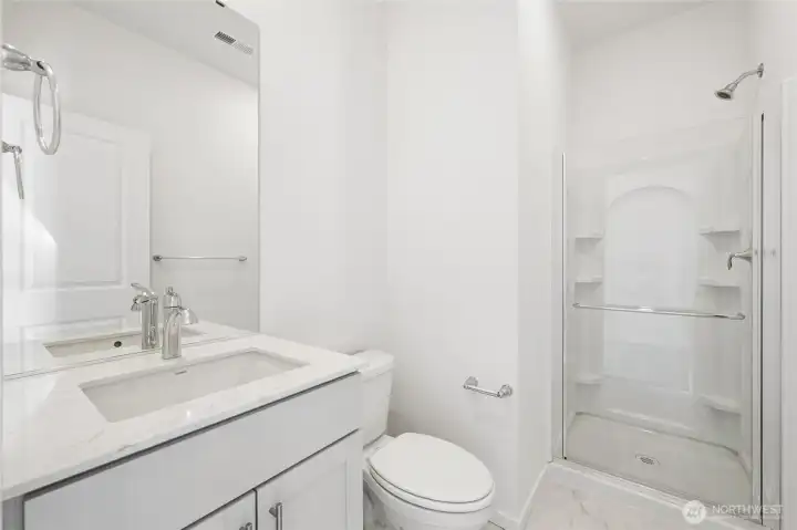 Downstairs bathroom with walk-in shower, quartz counter, undermount sink & vanity. Downstairs bathroom with walk-in shower, quartz counter, undermount sink & vanity.