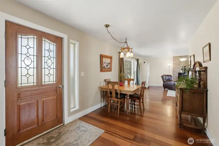 A view of the front door entry. You cans see the ding room/living room are off to your left as you enter. A view of the front door entry. You cans see the ding room/living room are off to your left as you enter.