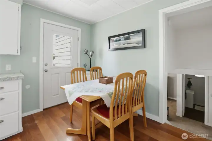 Here shows the back door to the back yard and deck. You can also see there is an eating area in the kitchen as well. Here shows the back door to the back yard and deck. You can also see there is an eating area in the kitchen as well.