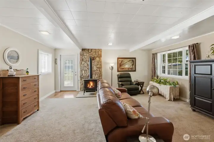 Here is a view into the large living room. There is a lot of natural light through the windows and glass door. Here is a view into the large living room. There is a lot of natural light through the windows and glass door.