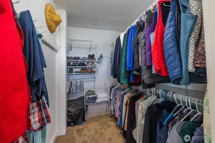 A photo of the primary bedroom closet, so nice and large and a great closet sys installed. A photo of the primary bedroom closet, so nice and large and a great closet sys installed.