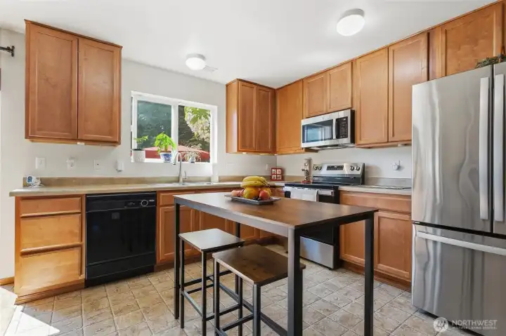 Kitchen with new Frig, stove and microwave. Kitchen with new Frig, stove and microwave.