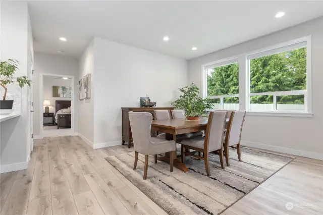 Dining Room overlooks back yard and HOA land behind the fence.