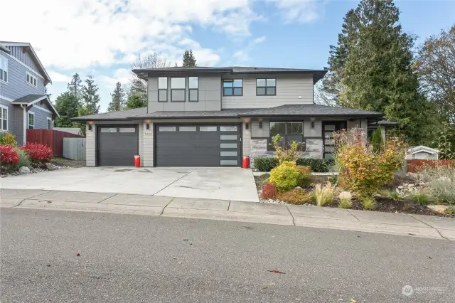 Ease to maintain front yard. Large three car garage.