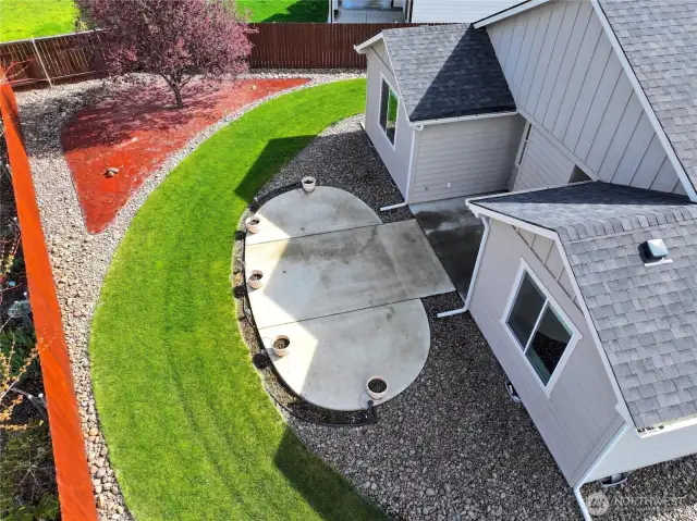 Extended patio in the back yard with underground sprinklers & drip lines