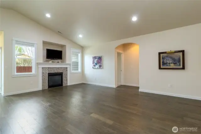 Living room with vaulted ceilings & gas fireplace