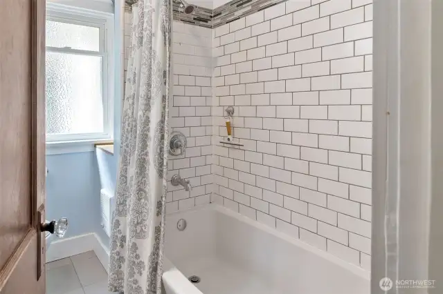Full height tiled shower on main level