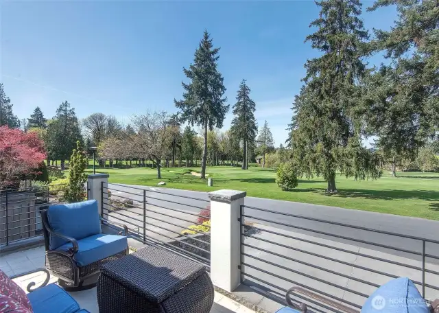Enjoy sunset views over the second fairway from the front deck, a serene space to unwind at the end of the day.